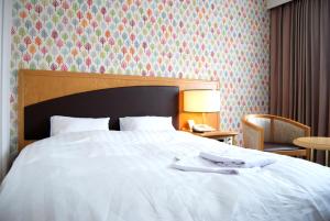 호텔 윙 인터내셔널 도마코마이 객실 침대