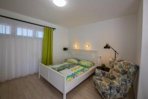 Postel nebo postele na pokoji v ubytování Hullam Rooms Siofok + 20 fotografií