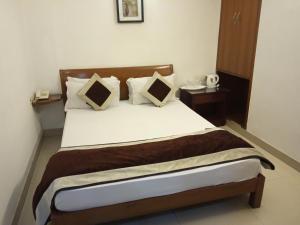 Postel nebo postele na pokoji v ubytování Solo Victoria Hotel