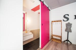 a bathroom with a toilet and a sink at Safestay Madrid in Madrid