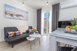 Televízia a/alebo spoločenská miestnosť v ubytovaní Apartment Marina Pavić 02