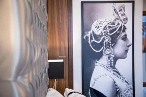 a framed picture of a woman with a diamond earring at Casual Belle Epoque Lisboa in Lisbon