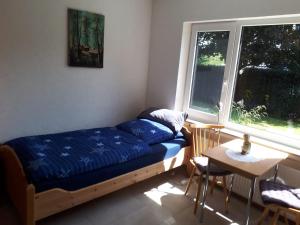 Ένα ή περισσότερα κρεβάτια σε δωμάτιο στο Ferienwohnung am Sorpesee