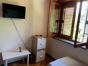 TV a/nebo společenská místnost v ubytování b&b Casa di Antonio_Etna Vacanze