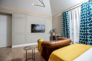 TV a/nebo společenská místnost v ubytování Apartamentos Pedregalejo