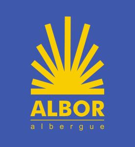 a blue and yellow school bus sign at Albergue Albor in Caldas de Reis