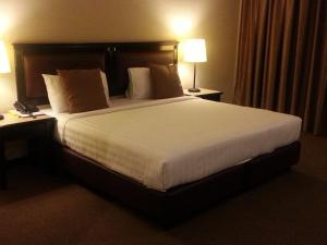 Cama o camas de una habitación en Hotel Mimosa