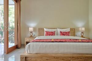 Postel nebo postele na pokoji v ubytování Gek House Ubud Bali