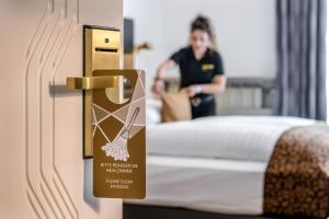 Giường trong phòng chung tại Hotel IMLAUER Wien