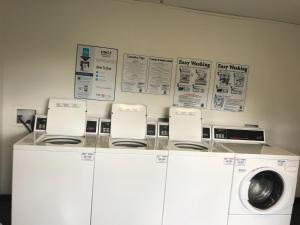 a room with a washing machine and a washer at InTown Suites Extended Stay Columbia SC - Columbiana in Columbia