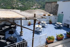 a view of a patio with tables and chairs at TRA... INCANTO E NATURA in Tramonti