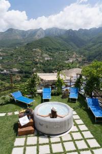 a woman laying in a large circle in the grass at TRA... INCANTO E NATURA in Tramonti