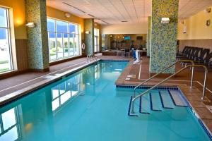 a swimming pool with blue water in a hotel room at Rhythm City Casino & Resort in Davenport