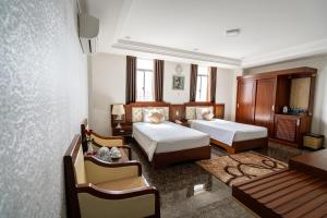 En eller flere senger på et rom på Duc Long Gia Lai Hotels & Apartment