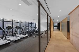 a gym with treadmills and elliptical machines at Hotel Paradiso Garden in Playa de Palma