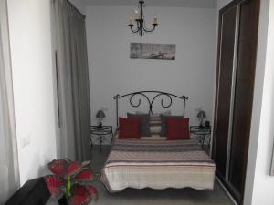 Postel nebo postele na pokoji v ubytování Hostal El Canario