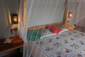 Postel nebo postele na pokoji v ubytování Golden Lodge Tangalle