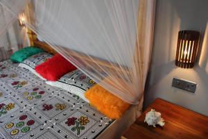 Postel nebo postele na pokoji v ubytování Golden Lodge Tangalle