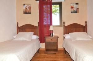 Ένα ή περισσότερα κρεβάτια σε δωμάτιο στο Villa Carmela