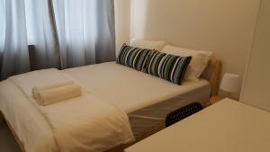 Postel nebo postele na pokoji v ubytování Redwood Residence