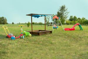 a group of childrens playground equipment in a field at Art Gallery B&B in Lonato