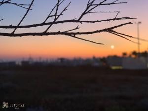 The sunrise or sunset as seen from a panziókat or nearby