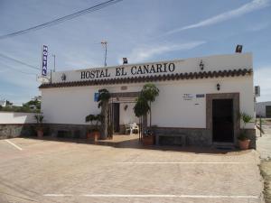 a building with a sign that reads hospital bc canaria at Hostal El Canario in Conil de la Frontera