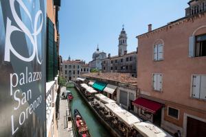 a view of a canal in a city with buildings at Palazzo San Lorenzo in Venice
