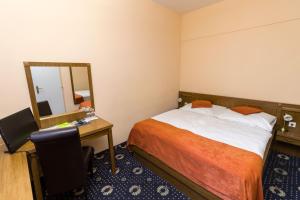 Ein Bett oder Betten in einem Zimmer der Unterkunft Penzion Gremium