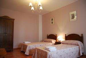 Postel nebo postele na pokoji v ubytování Casas Rurales Mirador Al Castillo