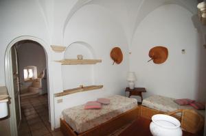 Postel nebo postele na pokoji v ubytování Villaggio In Case Sparse Nel Centro Storico