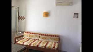 a white room with a couch against a wall at Villa dei pini in Vieste