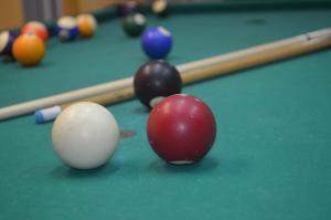 a group of billiard balls on a pool table at Pensiunea Magura in Baia Mare
