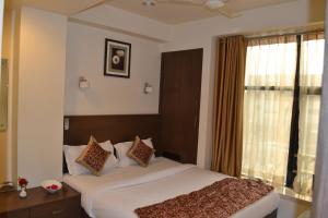 Cama o camas de una habitación en Hotel Adi