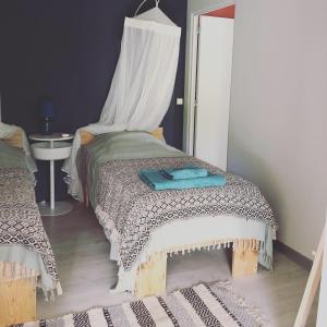 Ein Bett oder Betten in einem Zimmer der Unterkunft Ti coin paradis