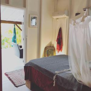Ein Bett oder Betten in einem Zimmer der Unterkunft Ti coin paradis