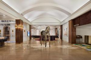a statue of a horse in the middle of a room at Saint Kate - The Arts Hotel in Milwaukee