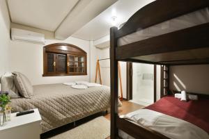Divstāvu gulta vai divstāvu gultas numurā naktsmītnē Hostel Chocolatchê