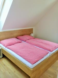 Postel nebo postele na pokoji v ubytování Rezidence Pálava