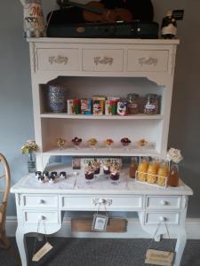 a white desk with food and drinks on it at The Kensington in Scarborough +18 photos