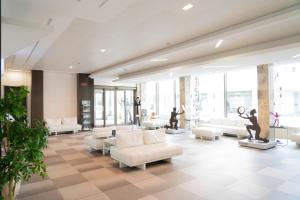 a lobby with couches and statues in a building at Hotel Nazionale in Matera