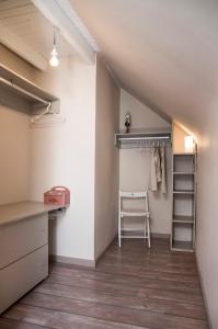 an attic room with a closet and a ladder at Apartamento Jaca Snow in Jaca