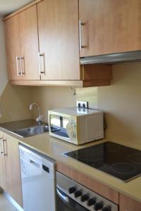 Η κουζίνα ή μικρή κουζίνα στο Atico Mar y Montaña