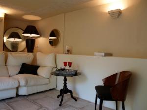 a living room with a white couch and a table at Villa Relax en Benidorm in Benidorm