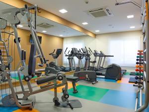 a gym with several tread machines in a room at Rio Hotel By Bourbon Campinas in Campinas