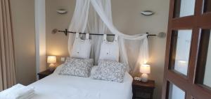 En eller flere senge i et værelse på Apartamento auténtico La Perla Playa