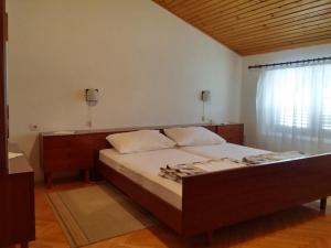 Posteľ alebo postele v izbe v ubytovaní Apartments Katarina