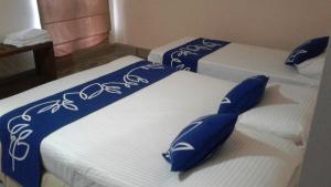 Letto o letti in una camera di Honey Tree Polonnaruwa