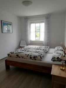 Posteľ alebo postele v izbe v ubytovaní Ferienwohnungen Zum Niederberg