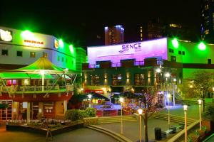 a group of buildings with green and purple lights at Ladywell House Suites - Chinatown - Self Check-in in Birmingham